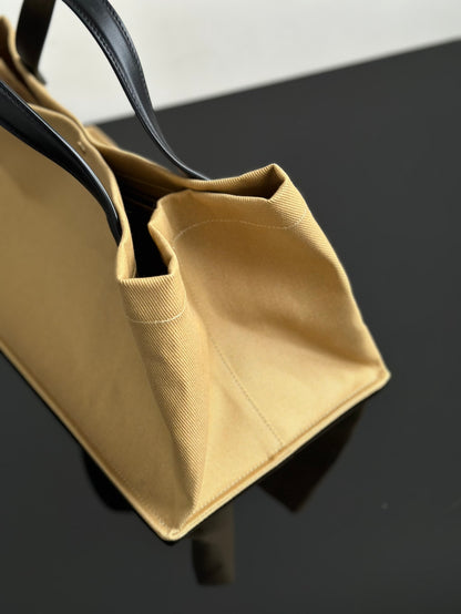 Two factories / The Row canvas bag