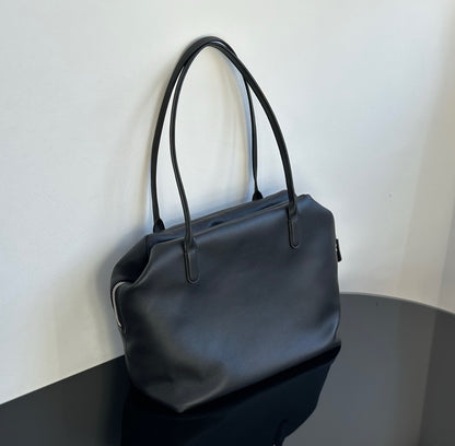 Both factories / The Row handbags