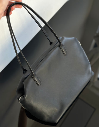 Both factories / The Row handbags