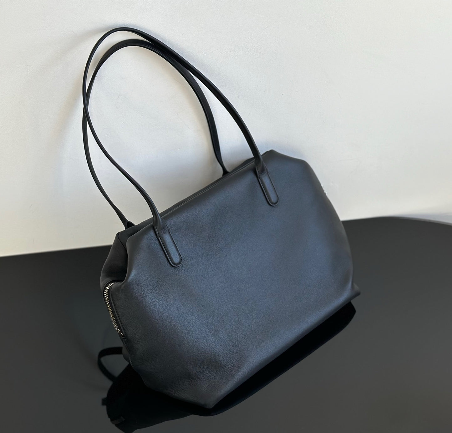 Both factories / The Row handbags