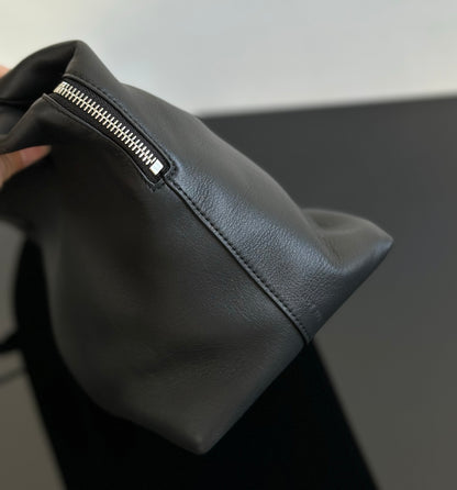 Both factories / The Row handbags