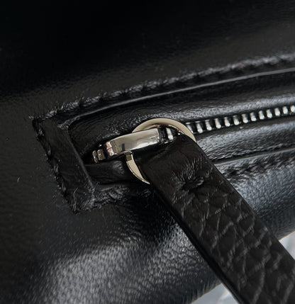 Both factories / The Row handbags