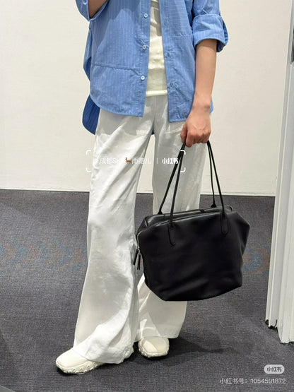 Both factories / The Row handbags