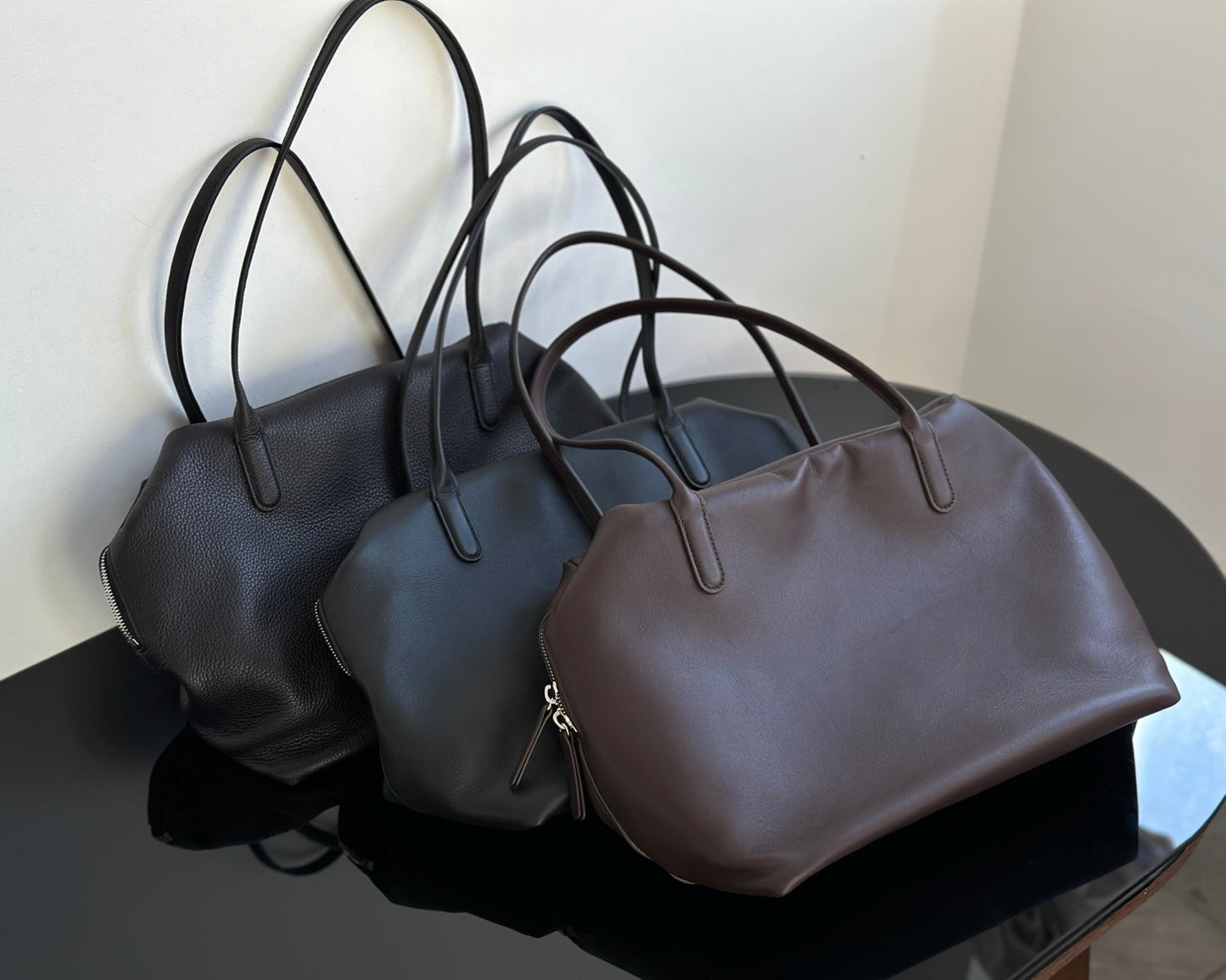 Both factories / The Row handbags