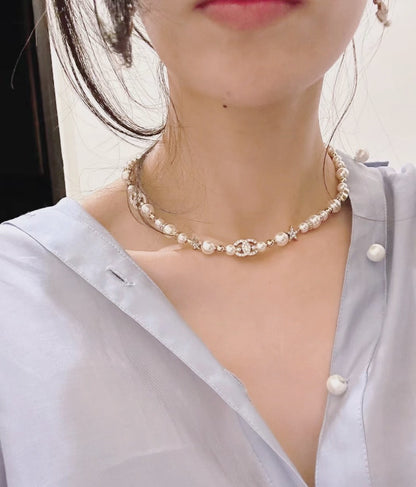 Boss accessories / Chanel pearl necklace