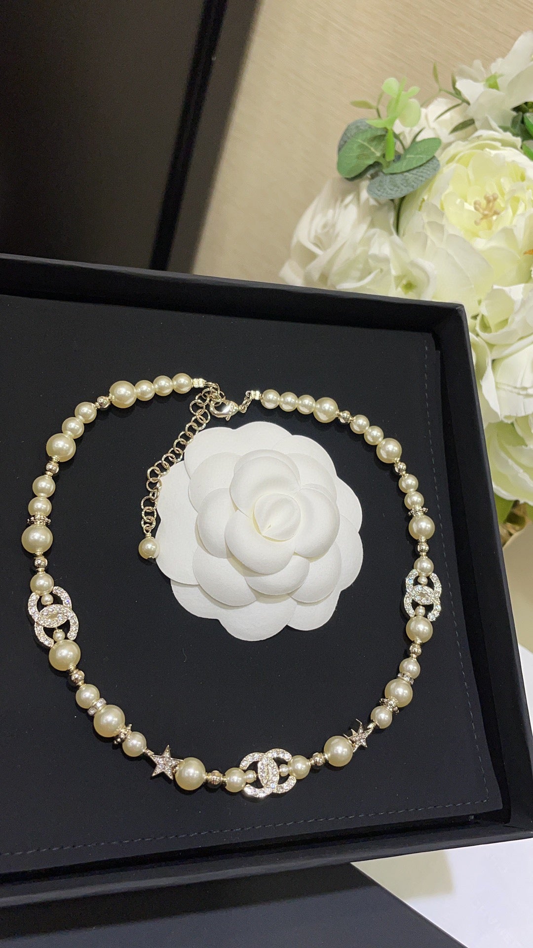 Boss accessories / Chanel pearl necklace