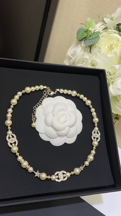 Boss accessories / Chanel pearl necklace
