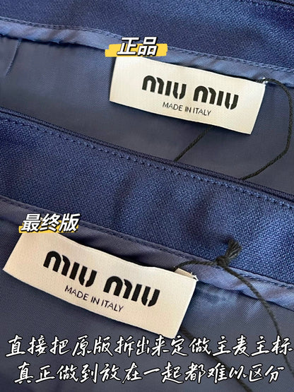Timo / Miu Miu pleated compressed logo blue mini skirt