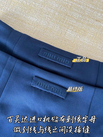 Timo / Miu Miu pleated compressed logo blue mini skirt